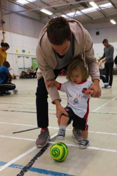 Toddlers playing football